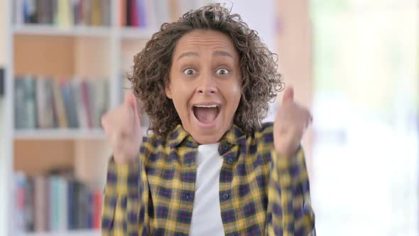 Portrait of Excited Mixed Race Woman Celebrating