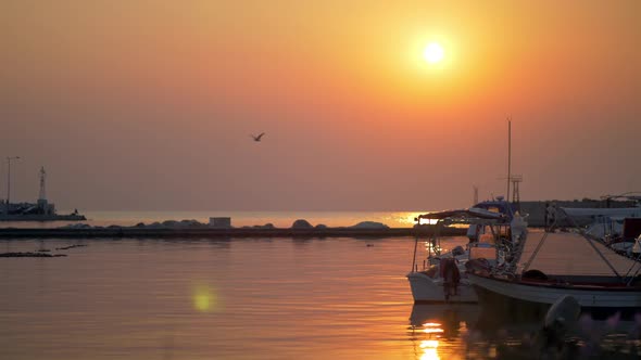 Waterscape with Harbour and Boats at Sunset