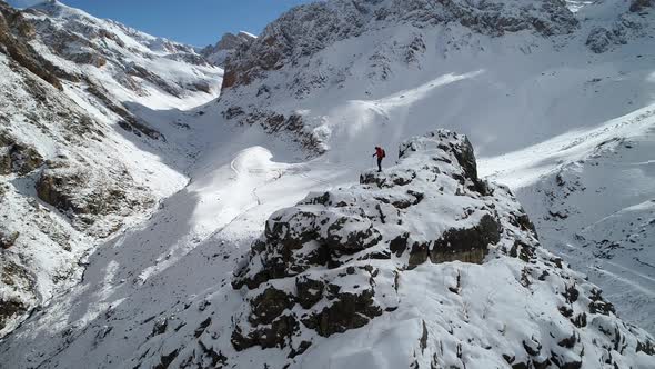 Hiker Looking Around In Mountain