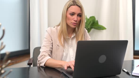 Young Woman in Casual Shirt Rejoicing at Job Success a Successful Deal