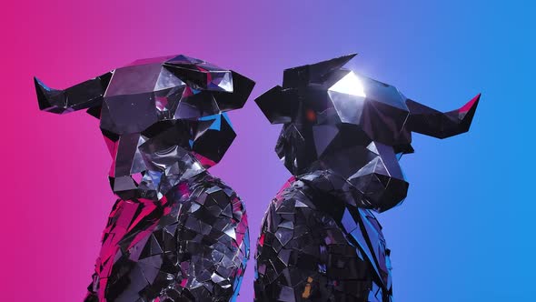 Two People in Creative Costumes of Bulls From the Mirrors Posing and Dancing on Neon Blue Pink