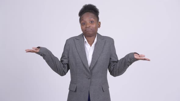 Young Confused African Businesswoman Shrugging Shoulders