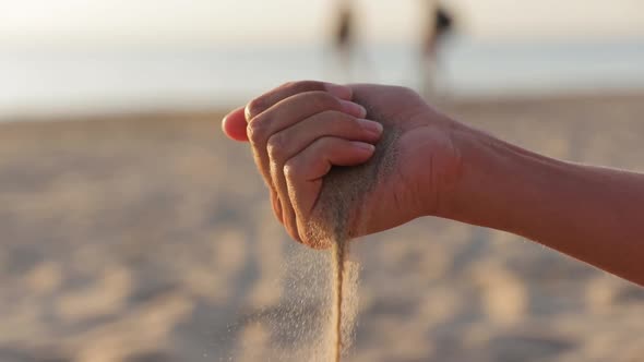 Sea Sand in a Women`s Hand