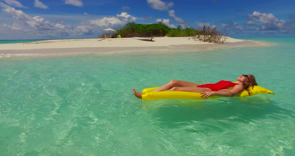 Young couple married on vacation enjoy luxury on beach on summer white sandy background 