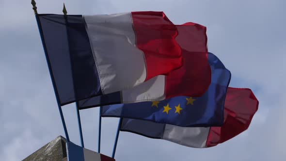 French and european flags waving in the wind
