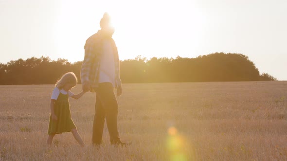 Two Silhouettes Family Parent Father Dad Man Farmer Holds Hand of Child Little Daughter Girl Small
