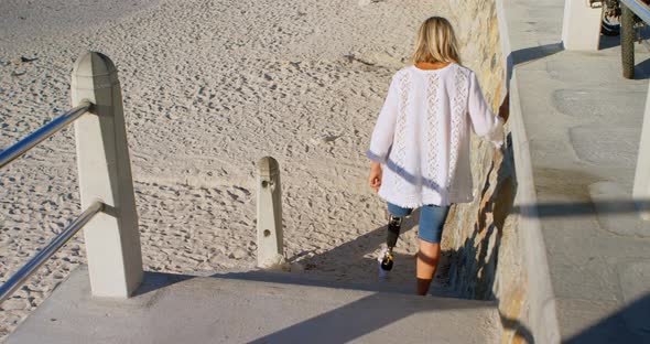 Disabled Woman Moving Downstairs in The Beach