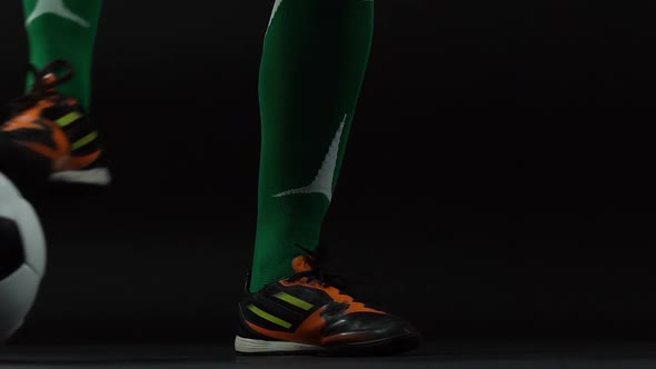 Soccer Man Legs With Ball on Dark Background, Kicker, Preparation for the Game