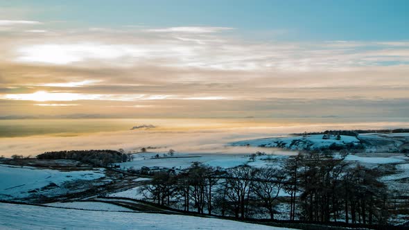 Cloud inversion covering the Eden Valley in Cumbria with the Lakeland mountains in the background, a