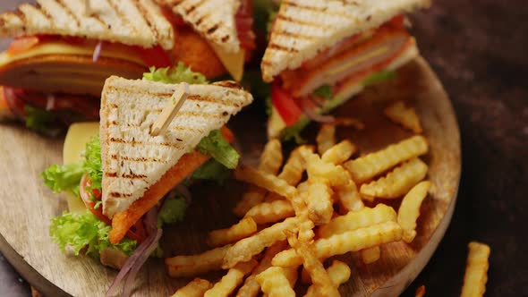 Club Sandwiches Served on a Wooden Board