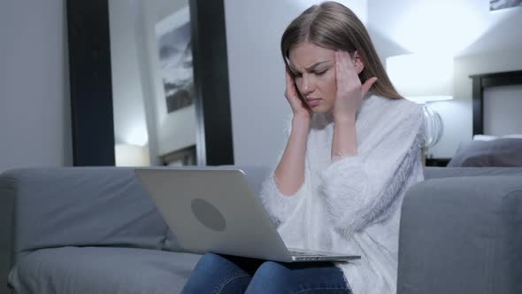 Tired Woman Sitting with Headache Pain