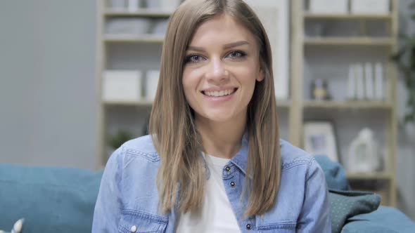 Portrait of Smiling Young Girl Looking at Camera