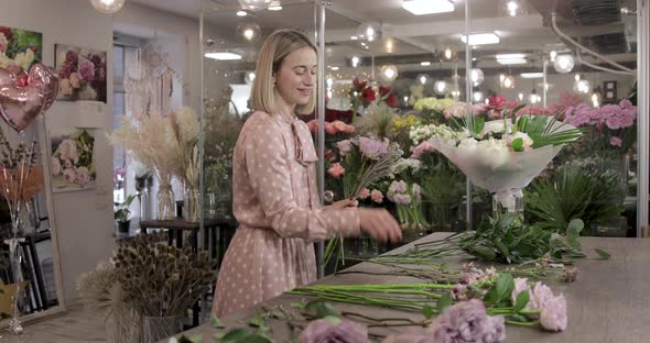 Florist Makes A Bouquet Of Flowers At Flower Shop