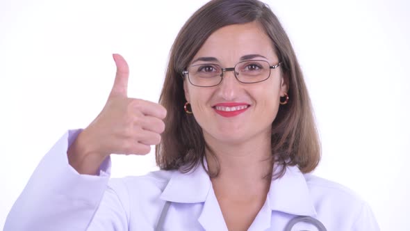Face of Happy Beautiful Woman Doctor Giving Thumbs Up