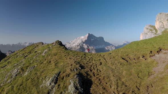 Aerial Unveil Man Hiker In Front of Civetta Mountain in Dolomites Italy