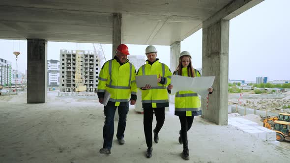 Engineering Team is Viewing Underconstruction Building in Construction Site