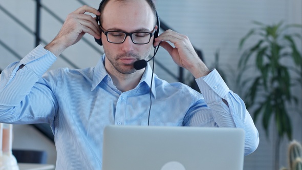 Young man working in a call centre