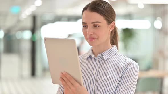 Portrait of Beautiful Young Woman Using Tablet 