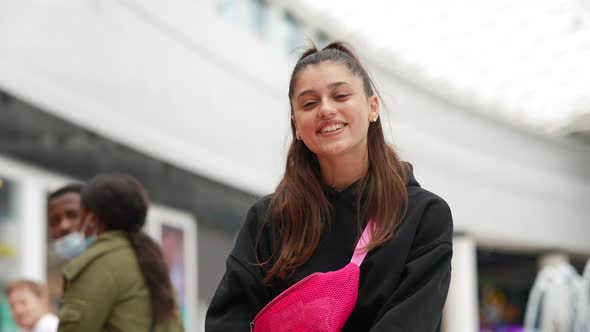 Young Woman Talking to the Camera in the Mall