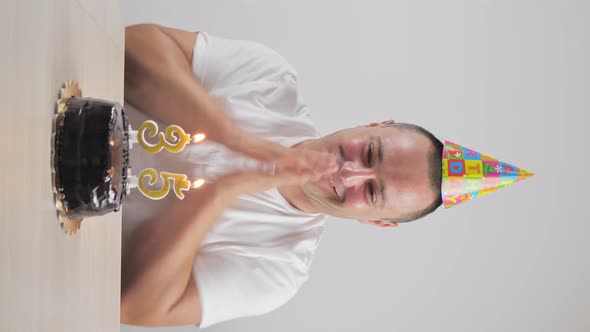 Cheerful Man Celebrating a Friend's Birthday Vertical Video