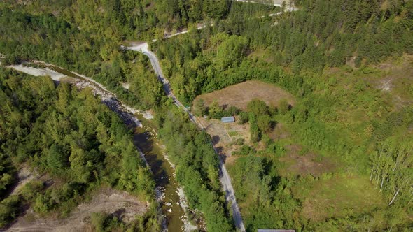 steep green mountains, deep forest and mountain road, beautiful valley and river