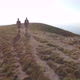 Drone view of two friends hiking in the Apennines, Umbria, Italy - VideoHive Item for Sale