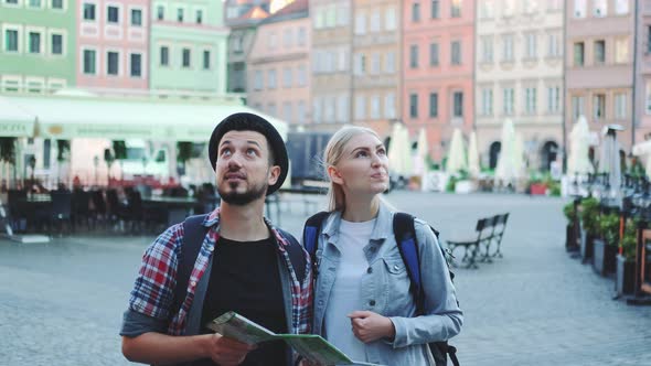 Tourists Looking on Main Tourist Attractions Using Map