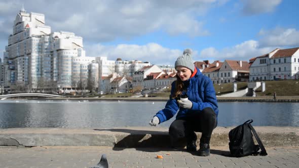 Caucasian Girl Student Feeding Pigeons