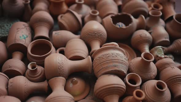 a large number of ceramic dishes and jugs on the plane, slow motion video