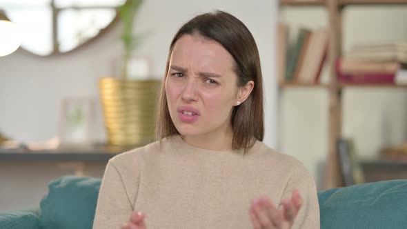 Portrait of Young Woman Having Loss at Home 