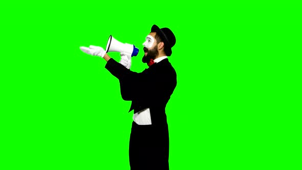 Funny Man Mime Uses Speaker and Talks To Somebody on Green Screen