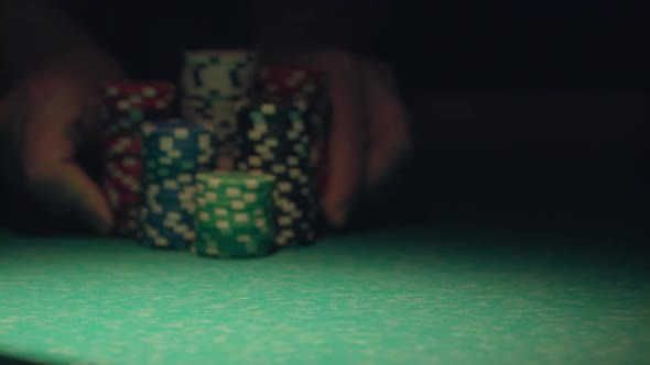 Croupier Moves Chips On Table At Casino.