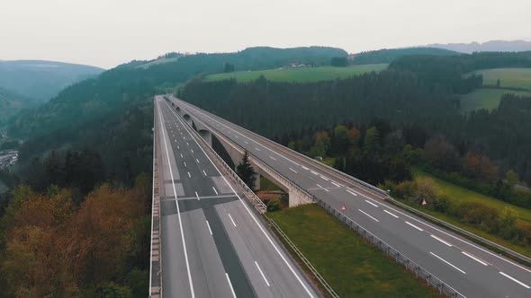 Aerial View of the Highway Viaduct on Concrete Pillars in the Mountains