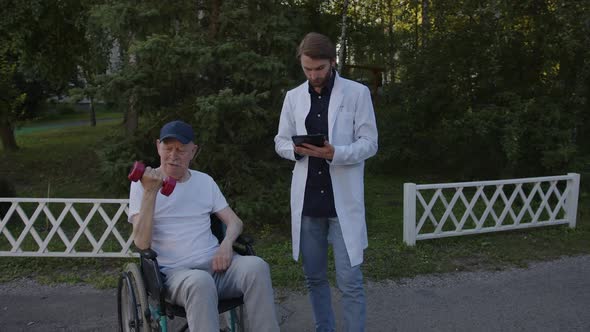 Old Man Hold a Dumbbell in His Right Hand