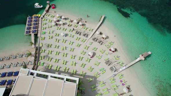 Aerial View Azure Beach with Empty Sun Loungers Balkan Coast Ionian Sea Albania