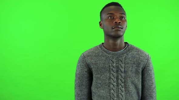 A Young Black Man Looks Around - Green Screen Studio