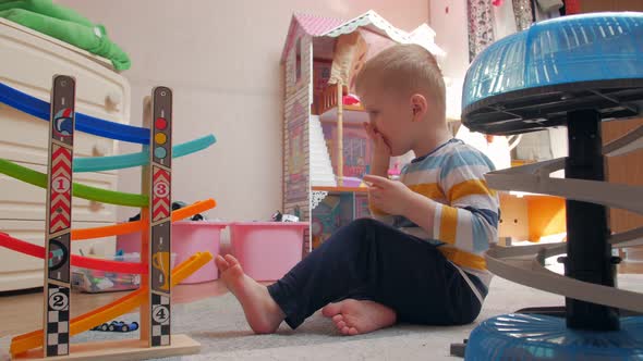 Little Boy Play And Chews Sandwich