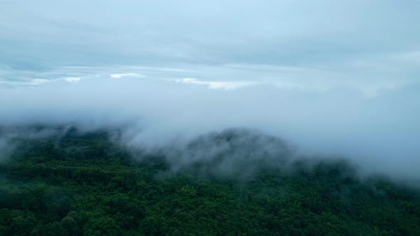 4K Aerial Drone shot flying over beautiful mountain ridge in rural jungle bush forest.