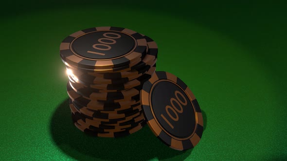 Poker chips in golden black colors on gambling table.