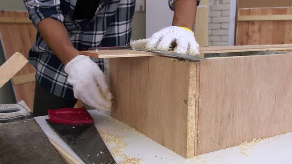 Carpenter Working on Wood Craft at Workshop