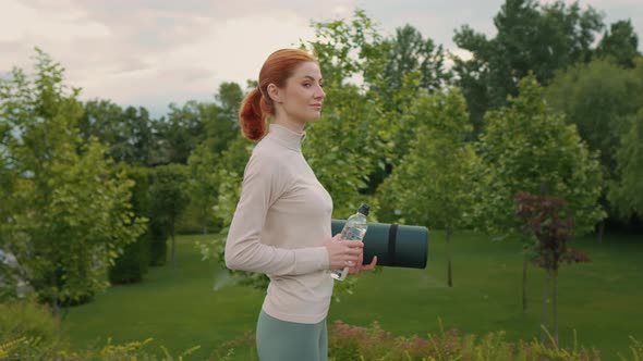 Woman getting ready doing sports looking to camera. Healthy lifestyle concept.