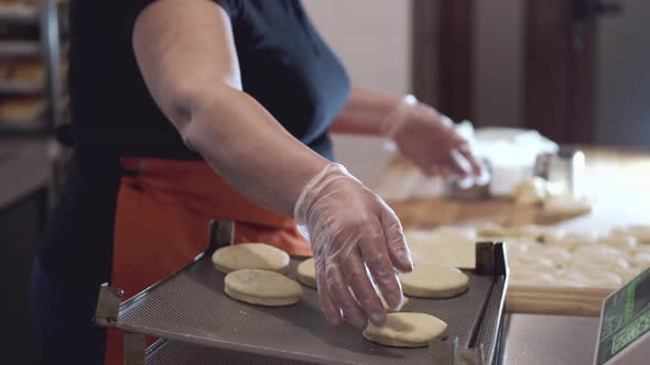 The Chef Is Putting the Round-shaped Pastry on a Support.