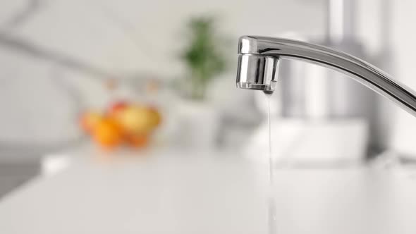 Water Dripping From Faucet Tap at Kitchen