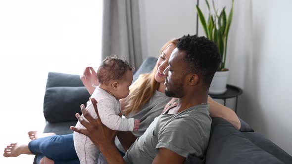 A Happy Multiracial Family of Three at Home