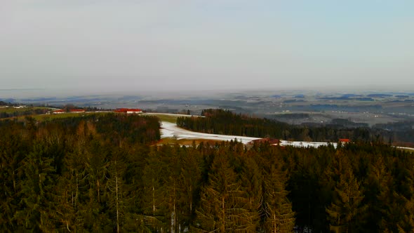 Drone Video with Forest and Village in the Winter