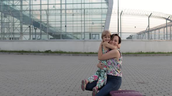 Mother Meet Her Daughter Child Near Airport Terminal with Open Arms After Long Flight Vacations Work