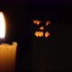 Halloween Pumpkin Glows Surrounded By Burning Candles - VideoHive Item for Sale