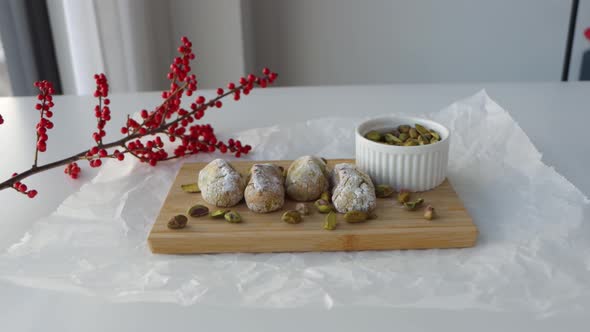 Shot zooming on a setup for food photography, chewy pistachio amaretti Christmas cookies