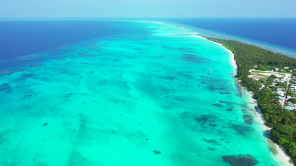 Beautiful aerial abstract shot of a sunshine white sandy paradise beach and blue ocean background in