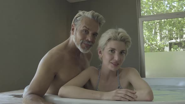 Couple relaxing in hot tub